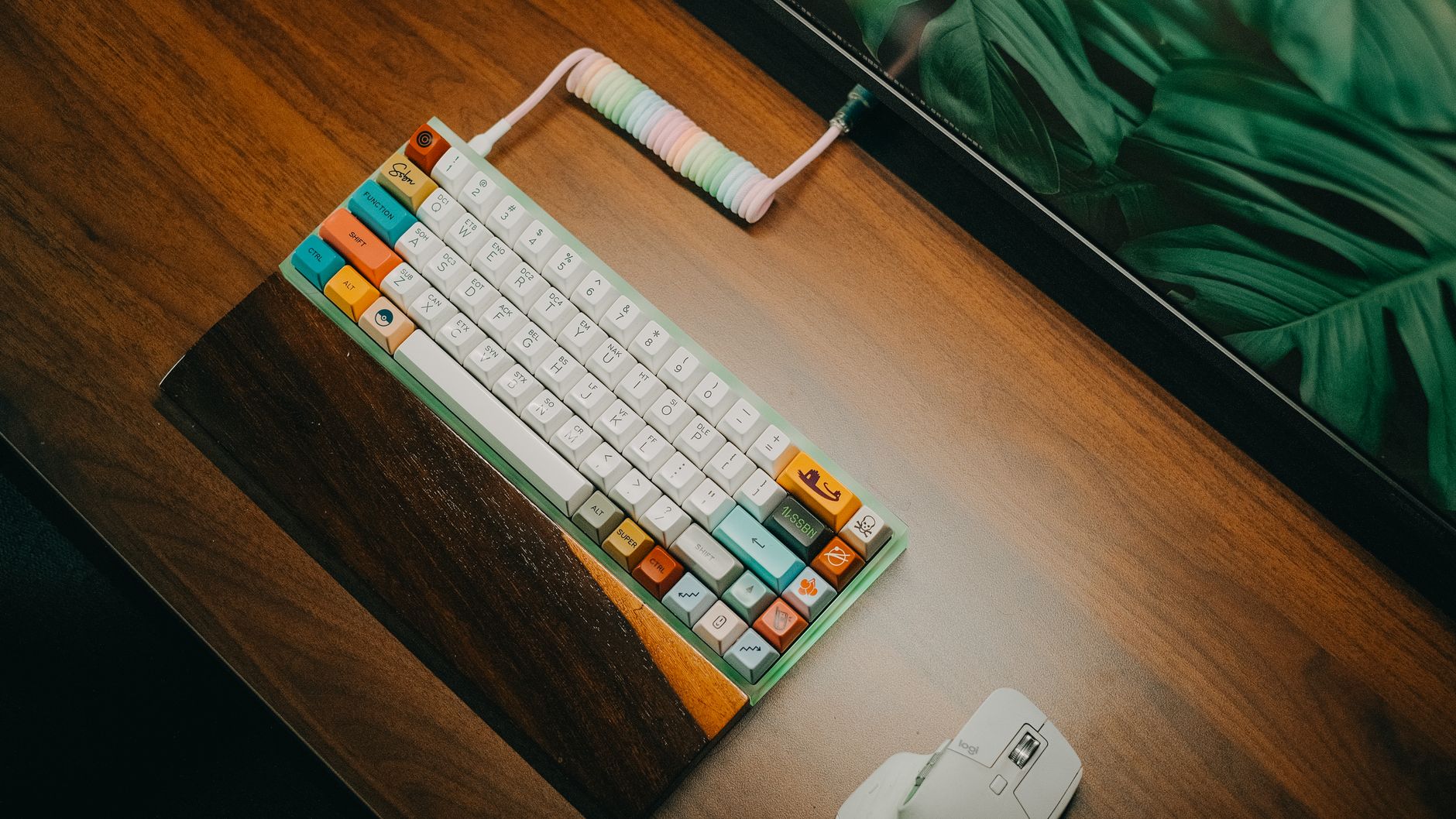 Stylish mechanical keyboard with colorful keycaps on wood desk, vibrant workspace.