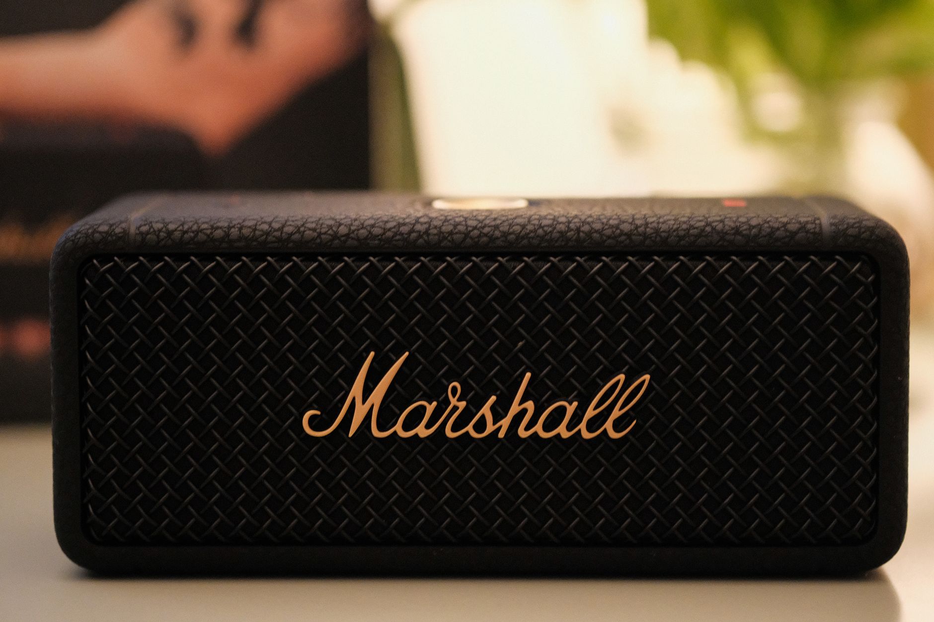 Close-up image of a Marshall portable Bluetooth speaker with textured design.